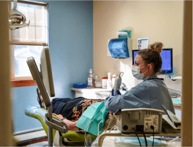 Dr. Eric's female colleague is checking a patient.