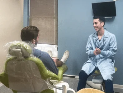 Dr. Eric's colleague is talking to a patient.