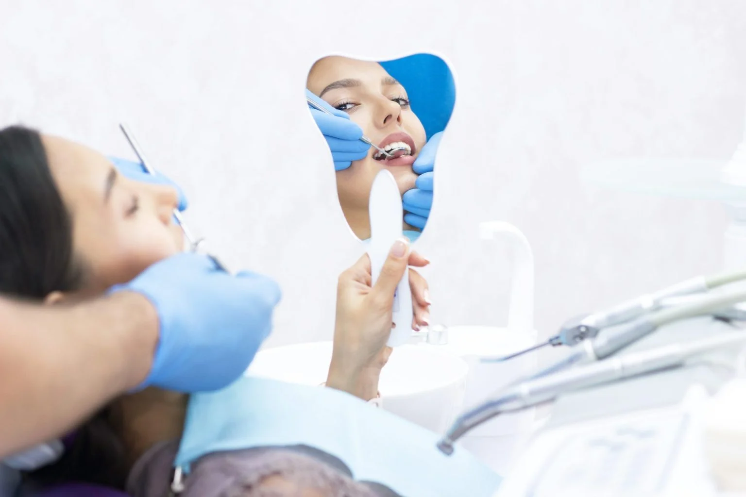 atisfied patient at the dentist. Who demonstrates his perfect smile